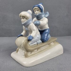 VTG Paul Sebastian Porcelana De‎ Cuernavaca Porcelain Children on Sled Figurine